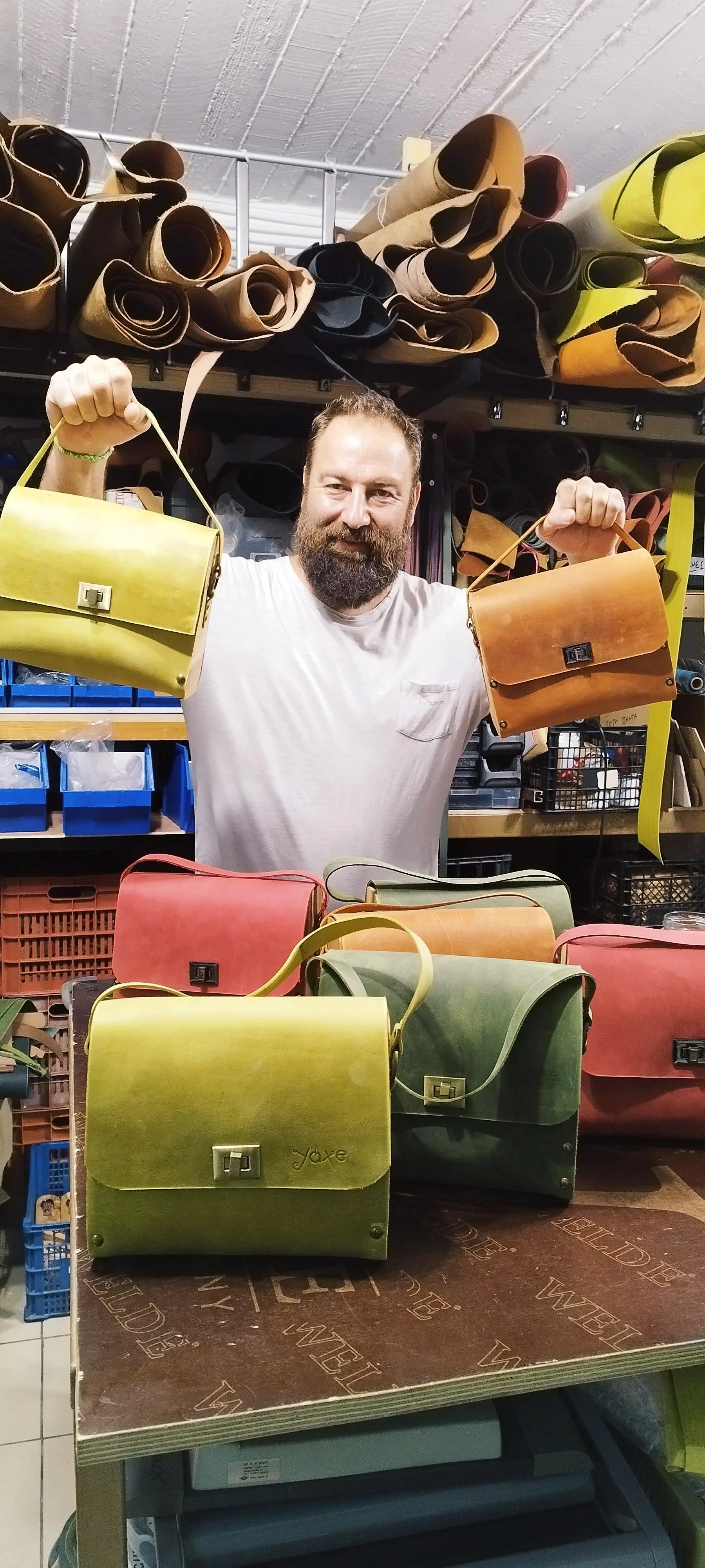 Green oil leather top handle bag and olive treee wood
