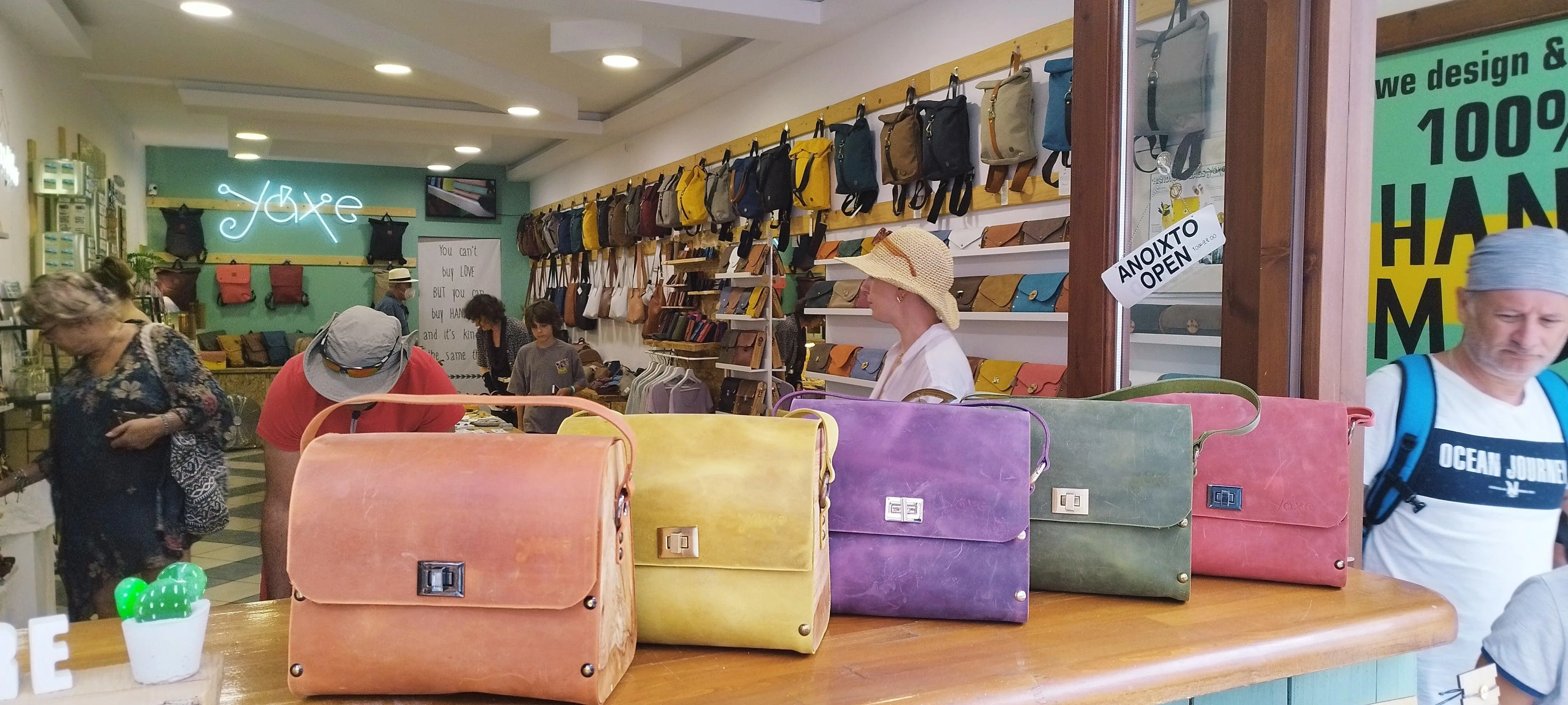 Green oil leather top handle bag and olive treee wood