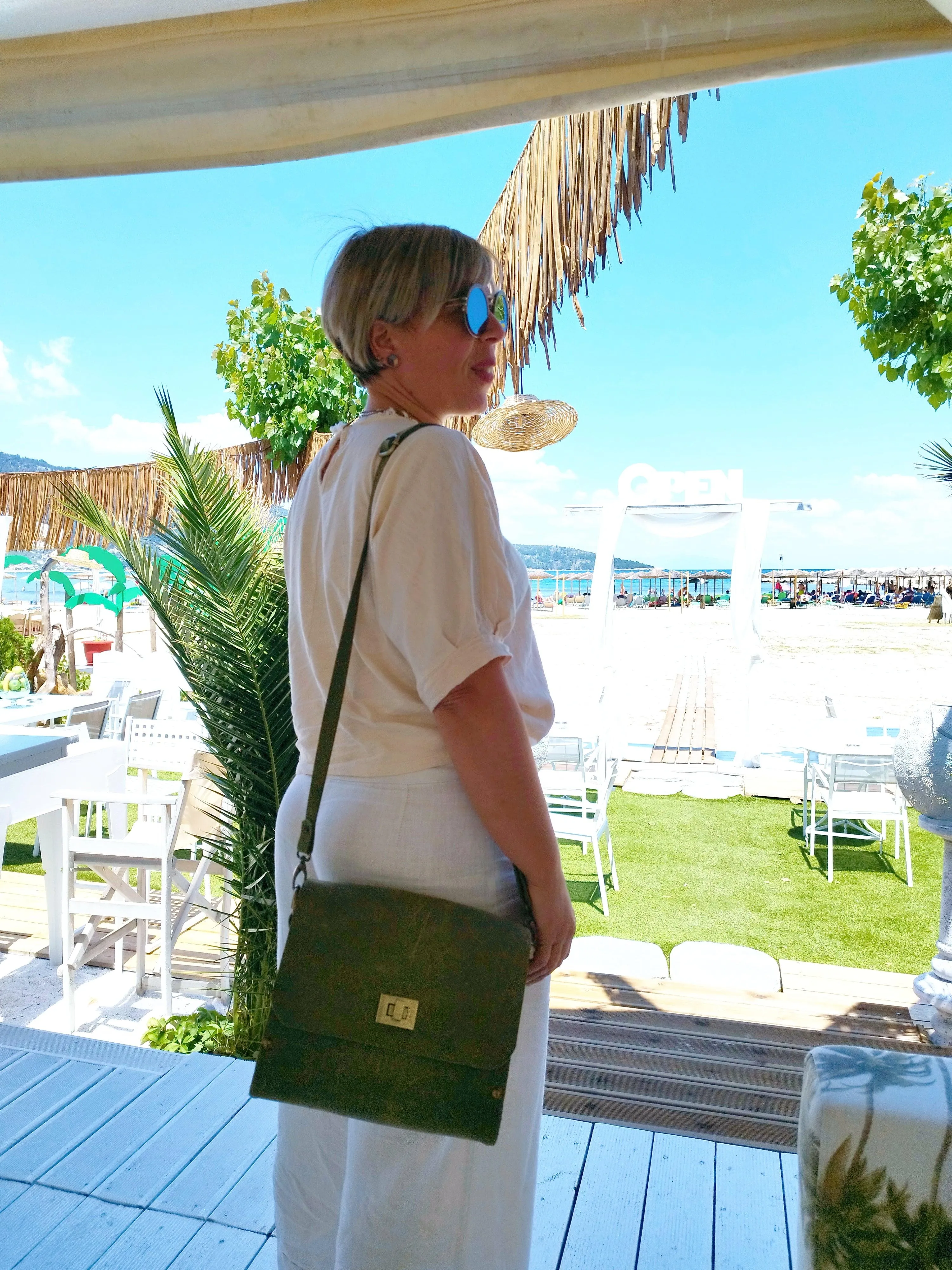 Green oil leather top handle bag and olive treee wood