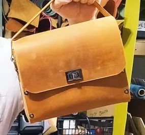 Orange oil leather top handle bag and olive treee wood